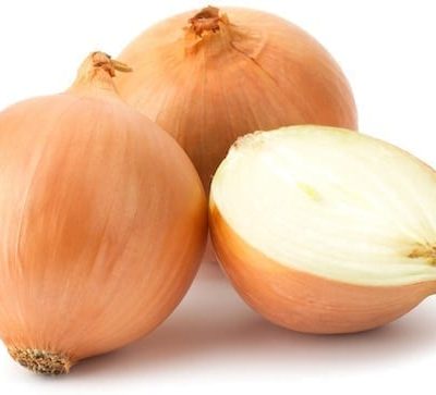 Fresh bulbs of onion on a white background
